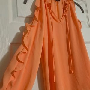 Beautiful peach blouse with ruffles and Peekaboo shoulder